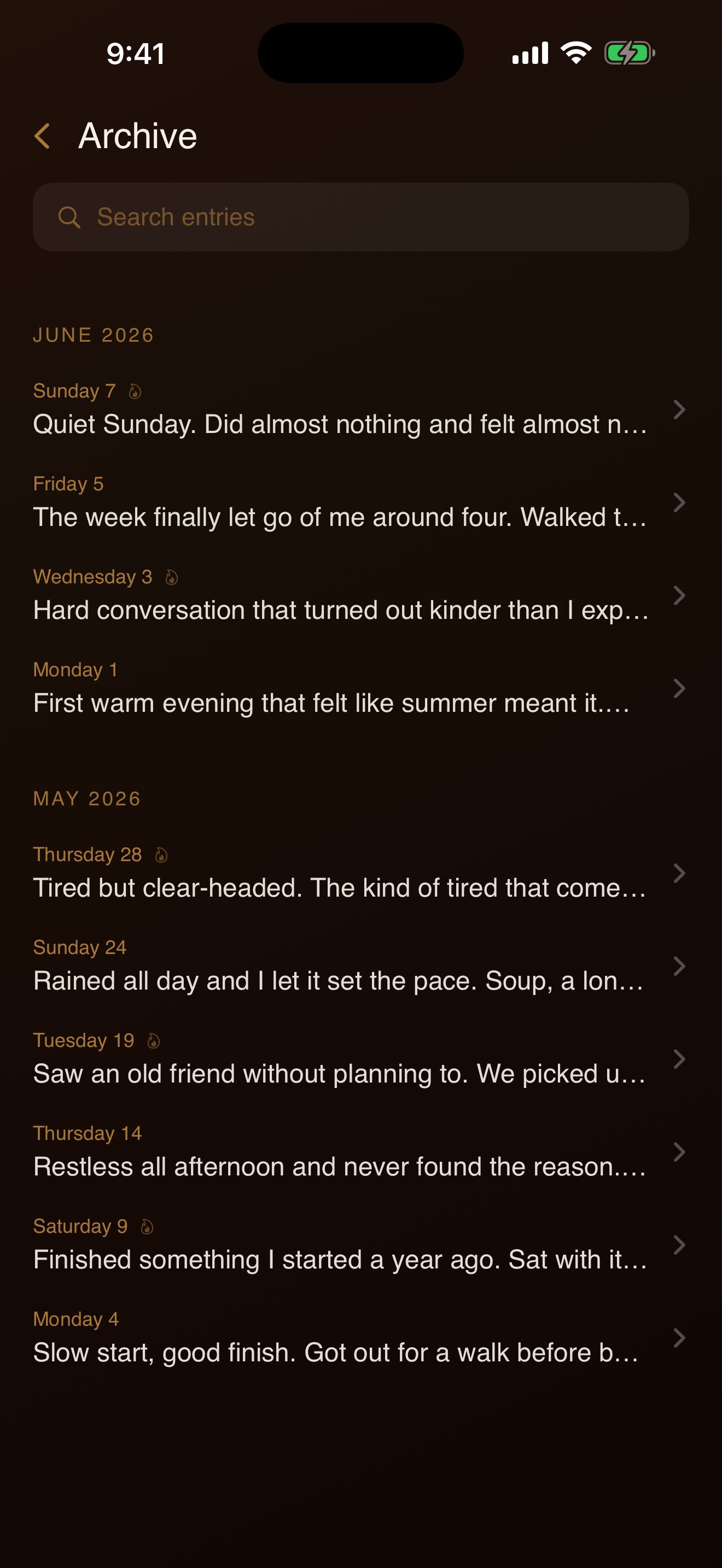 The Archive screen, showing past entries grouped by month, each with a short preview.